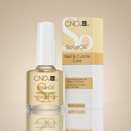 A bottle of CND SolarOil for nail and cuticle care, alongside its packaging box.